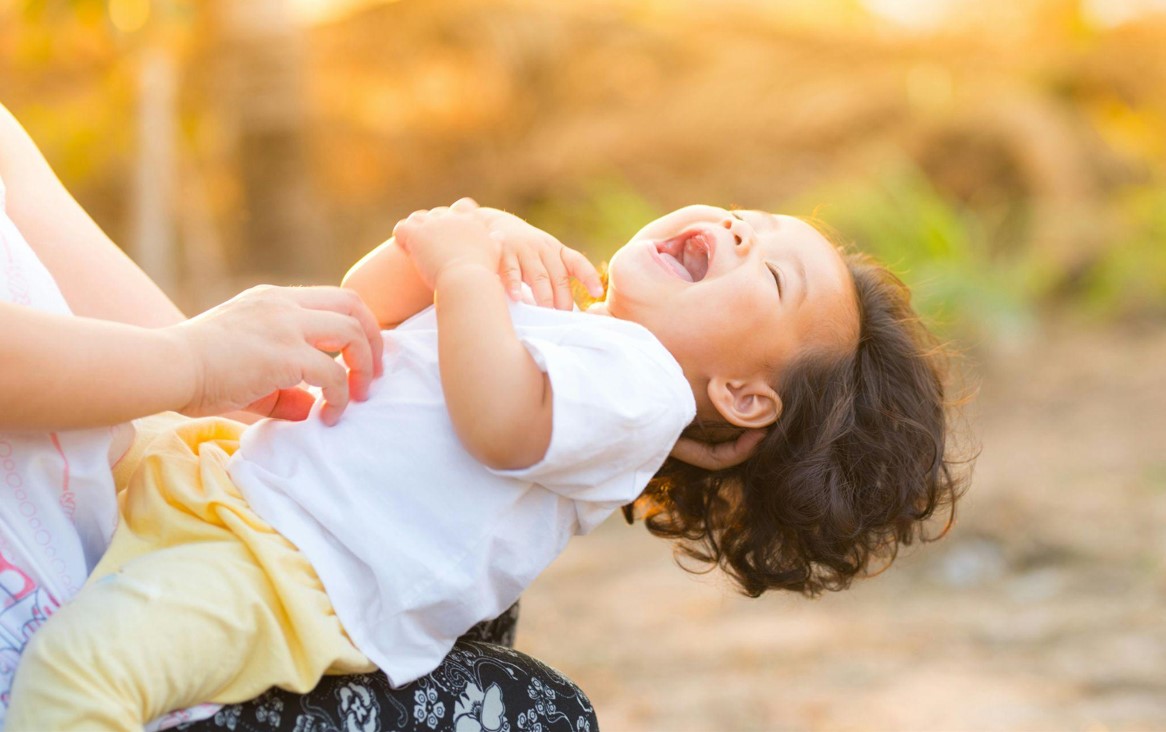 Child on mother's lap.